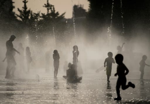 Kids cool off in Madrid as a heatwave sweeps across Europe with near-record temperatures