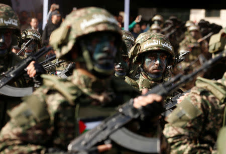 Palestinian Hamas militants take part in a rally marking the 30th anniversary of Hamas' founding, in Gaza City December 14, 2017. REUTERS/Mohammed Salem