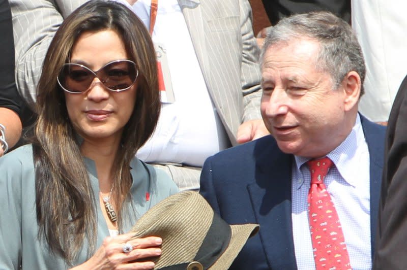 Michelle Yeoh and husband Jean Todt watch the French Open mens final match between Spaniard Rafael Nadal and Swede Robin Soderling at Roland Garros in Paris on June 6, 2010. File Photo by David Silpa/UPI