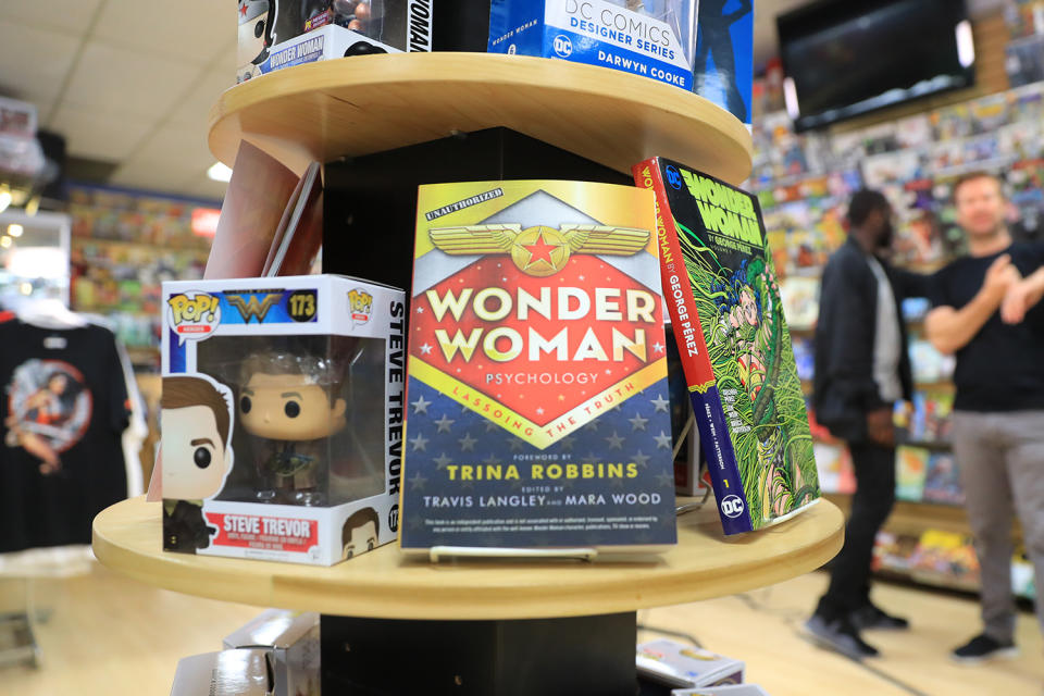 <p>Books and toys from characters of the “Wonder Woman” series are on display at Midtown Comics in New York City. (Gordon Donovan/Yahoo News) </p>