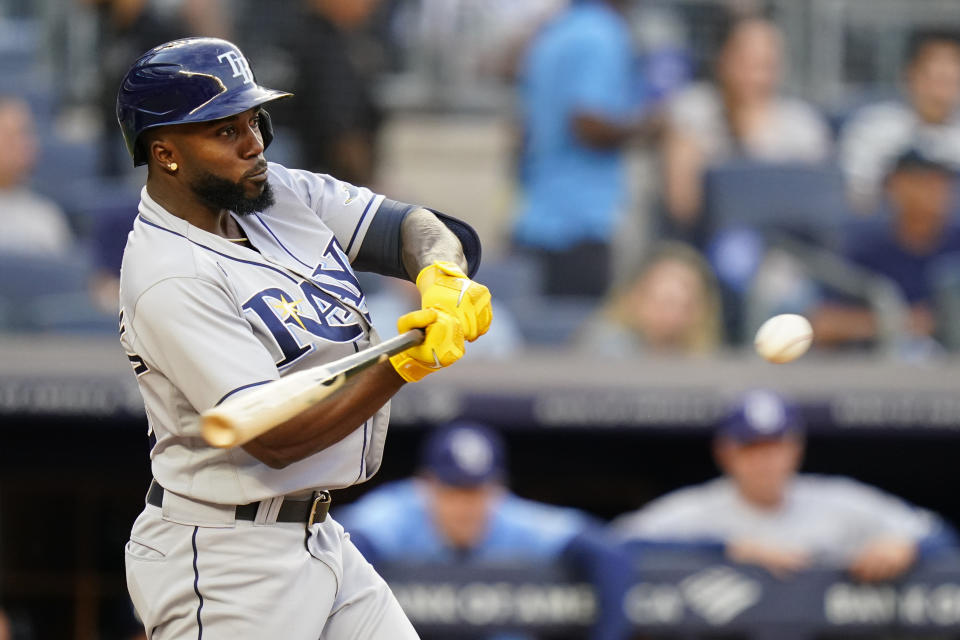 Tampa Bay Rays' Randy Arozarena hits a three-run home run during the first inning of the team's baseball game against the New York Yankees on Tuesday, Aug. 16, 2022, in New York. (AP Photo/Frank Franklin II)