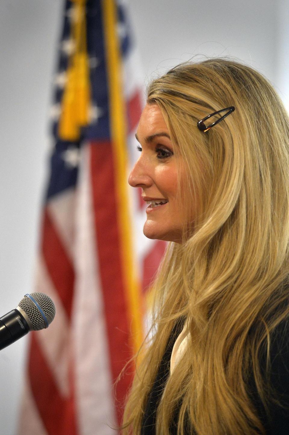 U.S. Sen.-designate Kelly Loeffler, a Republican businesswoman who will soon become Georgia's newest U.S. senator, answers questions at a press conference at the Georgia Ports Authority administrative offices Thursday, Jan. 2, 2020, at the Garden City Terminal in Garden City, Ga. Loeffler, who is scheduled to be sworn in when the Senate convenes Monday, Jan. 7, in Washington, said Thursday she plans to vote against removing President Donald Trump from office. (Steve Bisson/Savannah Morning News via AP)