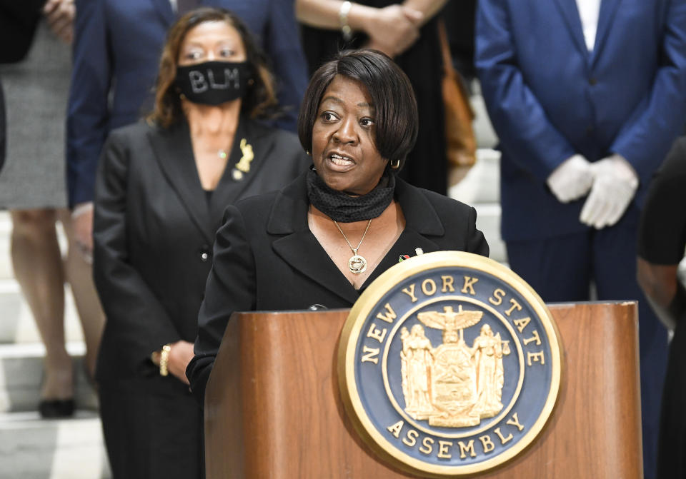 Assembly Majority Leader Crystal D. Peoples-Stokes, D- Buffalo, speaks in favor of new legislation for police reform while standing with Assembly members during a news briefing at the state Capitol Wednesday, June 8, 2020, in Albany, N.Y. New York lawmakers are poised to overhaul a decades-old law that has kept officers’ disciplinary records secret. The Democrat-led Legislature planned to pass a repeal of the law Monday as part of a package of reforms that would also ban officers from subduing people with chokeholds. Gov. Andrew Cuomo said he intends to sign the legislation. (AP Photo/Hans Pennink)