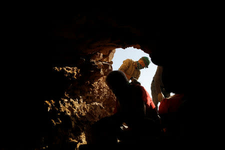Volunteers and archaeologists work at an archaeological dig near caves in the Qumran area in the Israeli-occupied West Bank January 15, 2019. Picture taken January 15, 2019. REUTERS/Ronen Zvulun