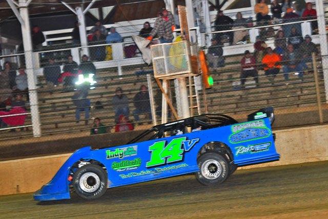 Bedford's Britan Godsey takes the white flag at Brownstown Speedway in the No.14V CS Prototyping/Travis Kern Racing Engines car while claiming his first win on April 16.