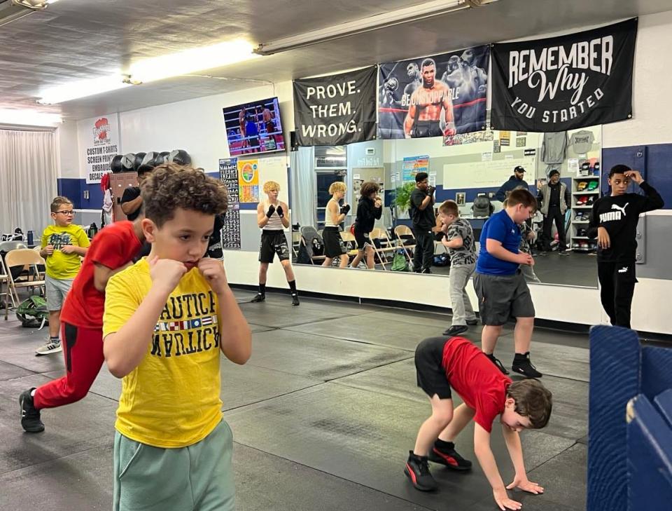 Young boys participate in boxing drills at United Boxing Club in Canton.