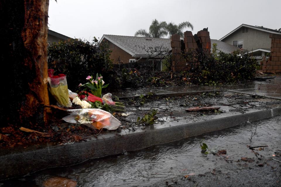 Flower bouquets mark the site of Friday's fatal crash in the 7200 block of Bristol Road in Ventura.