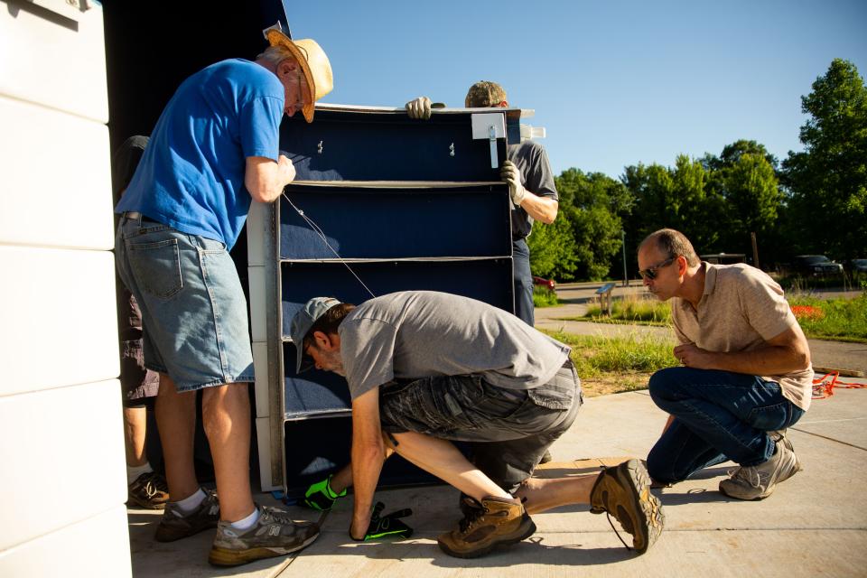 The door of the new public observatory by the Shoreline Amateur Astronomical Association is installed Friday, June 24, in West Olive.