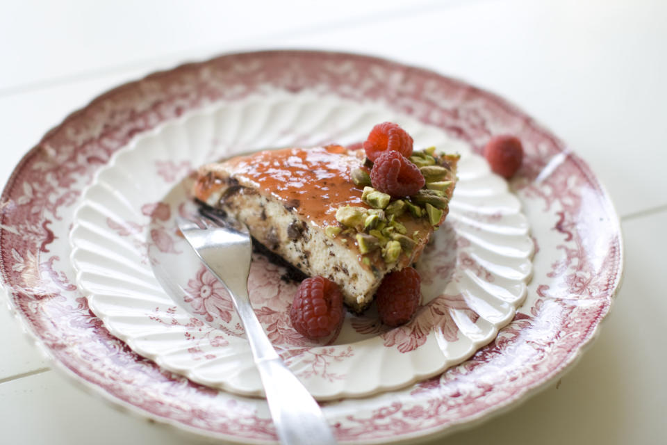 This Nov. 11, 2013 photo shows red currant and chocolate cheesecake in Concord, N.H. In this recipe, chopped chocolate is a distinct, toothsome confetti strewn throughout the cake. (AP Photo/Matthew Mead)