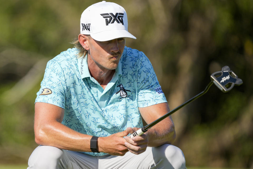 Jake Knapp, of the United States, studies his putt at the 16th green during the final round of the Mexico Open golf tournament in Puerto Vallarta, Mexico, Sunday, Feb. 25, 2024. (AP Photo/Fernando Llano)