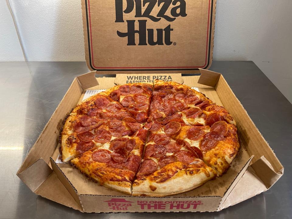 pizza hut pizza in a box with pepperoni