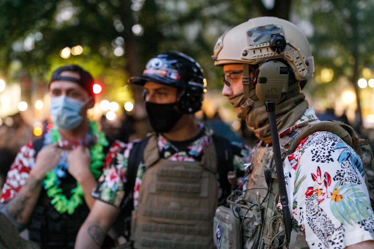 The 'Boogaloo Bois', an armed libertarian group, dress in their signature Hawaiian shirts during a protest on 24, 2020 in Portland, Oregon.  (John Rudoff/Anadolu Agency via Getty Images)