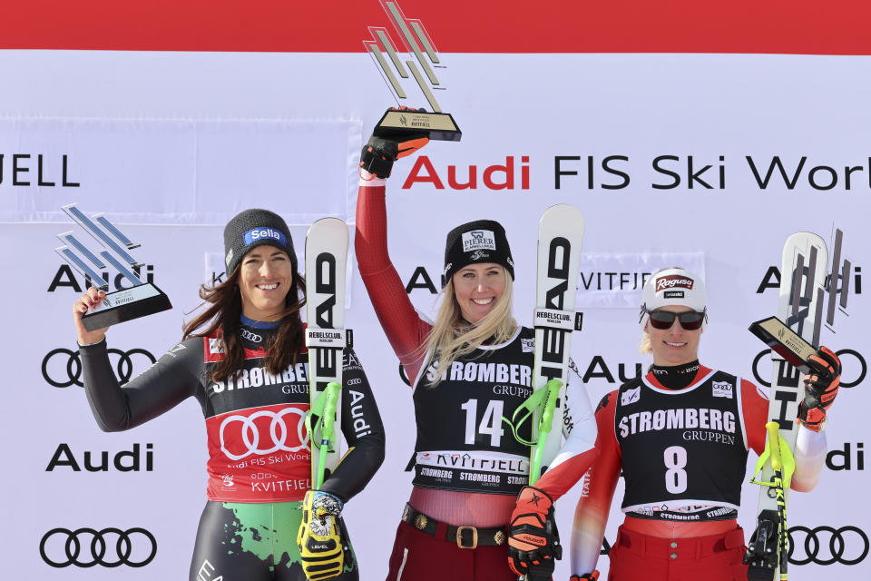 From left, second placed Italy's Elena Curtoni, the winner Austria's Cornelia Huetter and third placed Switzerland's Lara Gut Behrami celebrate after an alpine ski, women's World Cup Super G race in Kvitfjell, Norway, Friday, March 3, 2023. (AP Photo/Marco Trovati)
