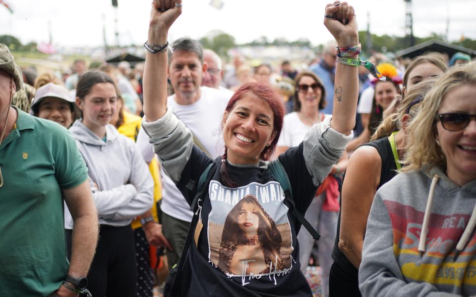 A Shania Twain fan awaits the country star's set