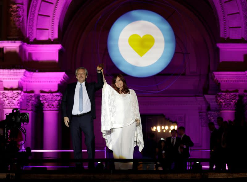 Argentina's President Alberto Fernandez and Vice President Cristina Fernandez de Kirchner on stage outside the Casa Rosada Presidential Palace after inauguration, in Buenos Aires