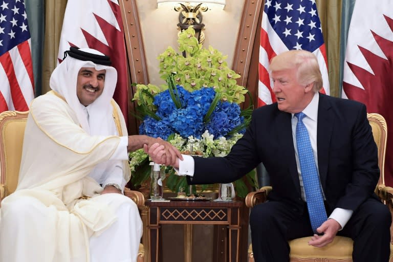 US President Trump, who had initially backed the measures against Qatar in a tweet, called Sheik Tamim (L) on Wednesday with an offer "to help the parties resolve their differences"