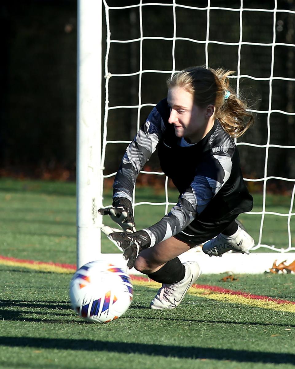 Norwell goalie Belle Pettit makes a save during penalty kicks to help secure their win over Pope Francis in the Elite 8 game of the Division 3 state tournament at the Norwell Clipper Community Complex at Norwell High School on Saturday, November 11, 2023. Norwell would go on to win 3-2 in Penalty Kicks (4-1).