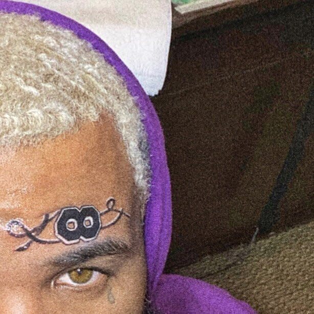 The Game got a face tattoo of one of Bryant's Los Angeles Lakers numbers to honor the star, and captioned his post, "♾ F O R E V E R," on <a href="https://www.instagram.com/p/B8ek5gBpPzy/" rel="nofollow noopener" target="_blank" data-ylk="slk:Instagram;elm:context_link;itc:0;sec:content-canvas" class="link ">Instagram</a>.