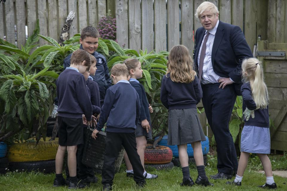 Prime Minister Boris Johnson talks with primary school children in Cornwall (Jack Hill/The Times/PA) (PA Wire)