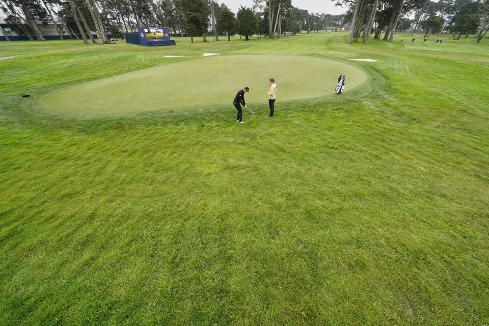 Matthias Schwab chips to the green on the fourth hold during a practice round for the PGA Championship golf tournament at TPC Harding Park Wednesday, Aug. 5, 2020, in San Francisco. (AP Photo/Charlie Riedel)