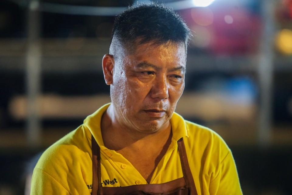 Fried fishball hawker and association committee member Chin Kwek Keong, 52, feels the faction is undermining their efforts to make the ‘pasar malam’ a cleaner, safer place. — Picture by Hari Anggara