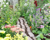 <p> Using reclaimed bricks for a cheap DIY garden path will add character to your space as well as allowing you to tie in the new walkway with other parts of the exterior of your house. To create a coherent overall look, it can be helpful to ensure the new path will reflect the surrounding brickwork. </p> <p> Not only is opting for reclaimed materials a great way to save money in the garden, but whether you source them from a reclamation company or utilize materials left over from another project, it's also good for environmental credentials too.  </p> <p> 'Using reclaimed bricks that are spare from another home project is not only cost effective but it's also a good eco landscaping idea as it's a form of unprocessed recycling,' says garden designer Nathan Gamba at Protea Gardens. 'It reduces the need to produce more materials and saves on waste.'  </p> <p> Choosing more rustic looking reclaimed bricks or pavers like the ones pictured is ideal if you're hoping to create an attractive cottage garden path in your plot too.  </p>