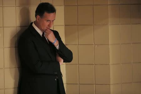 Republican U.S. presidential candidate and former U.S. Senator Rick Santorum waits his turn to speak during the Voters First Presidential Forum in Manchester, New Hampshire August 3, 2015. REUTERS/Brian Snyder