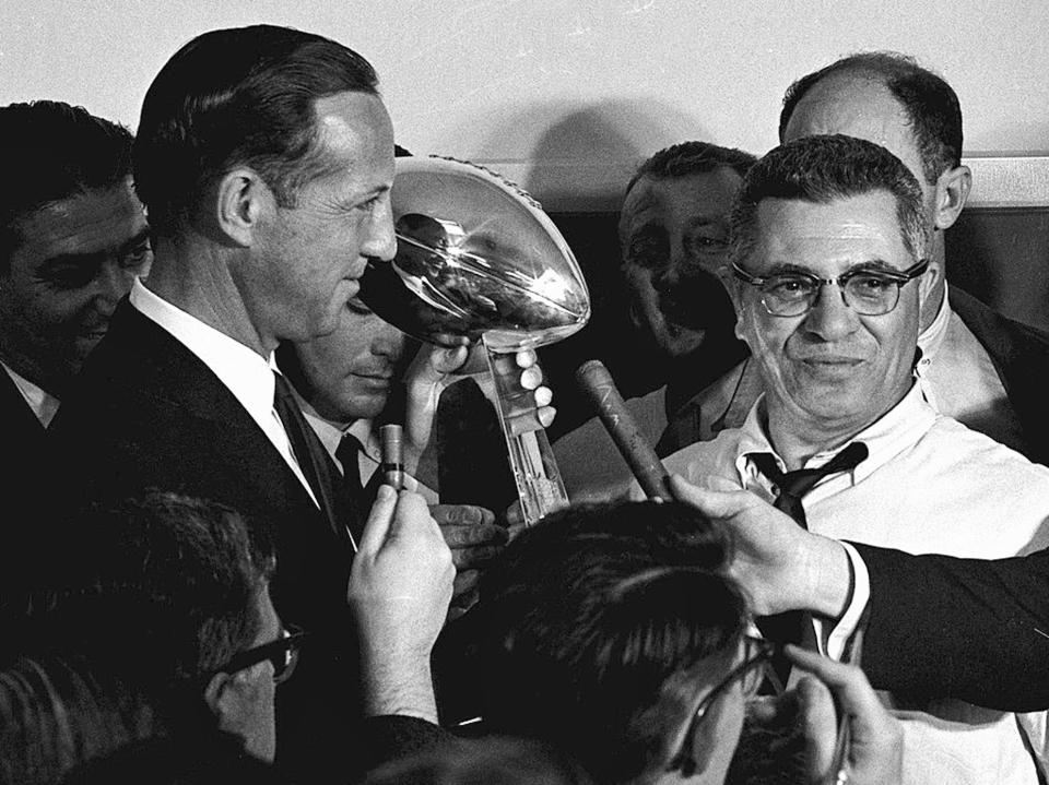 FILE - Football commissioner Pete Rozelle, left, presents the trophy to Green Bay Packers coach Vince Lombardi after they beat the Kansas City Chiefs in the Super Bowl in Los Angeles, Jan. 15, 1967. The trophy for the Super Bowl winner has borne Lombardi's name since his death in 1970. (AP Photo, File)