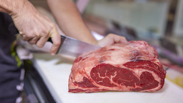 Sirloin steak being hand-cut