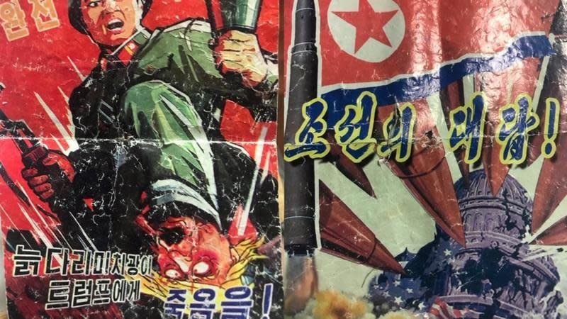 A leaflet produced by North Korea with drawings of a North Korea flag, and a soldier stepping on Donald Trump's head.