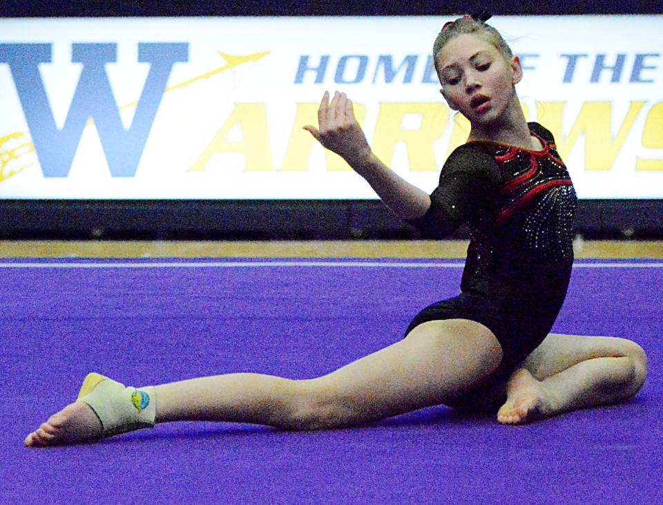 Hannah Cutshaw of Deuel is shown during her floor-exercise routine Thursday during the Watertown Invitational gymnastics meet in the Civic Arena.