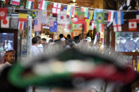 Visitors walk at the Souq Waqif Market in Doha, Qatar, Friday, Nov. 25, 2022. (AP Photo/Eugene Hoshiko)