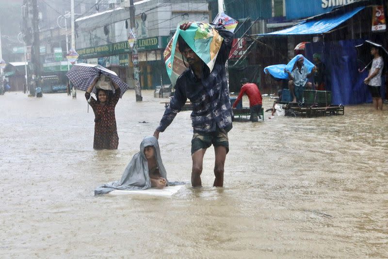 People look for shelter amidst flooding in Sylhet