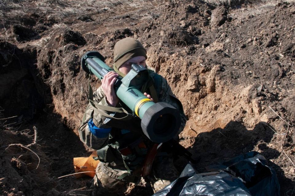 Ukrainian servicemen attend their positions in Kharkiv, (EPA)