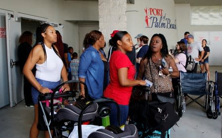 Passengers are shown after disembarking the Bahamas Paradise Cruise Line ship, Grand Celebration, in Riviera Beach