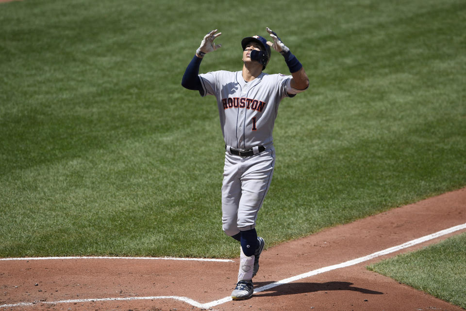 Houston Astros' Carlos Correa celebrates his three-run home run during the second inning of a baseball game against the Baltimore Orioles, Sunday, Aug. 11, 2019, in Baltimore. (AP Photo/Nick Wass)