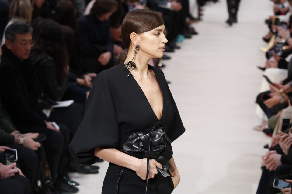 Model Irina Shayk wears a creation for the Valentino fashion collection during Women's fashion week Fall/Winter 2020/21 presented in Paris, Sunday, March 1, 2020. (AP Photo/Francois Mori)