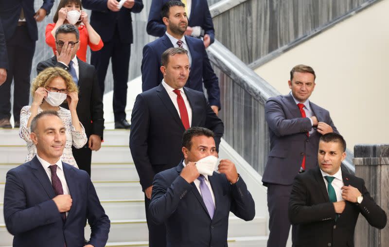 Zaev, leader of the ruling SDSM party, adjust his face mask during a group photo with newly elected ministers at the Macedonian parliament in Skopje, North Macedonia
