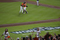 Houston Astros relief pitcher Kendall Graveman and catcher Martin Maldonado celebrates after Game 2 of baseball's World Series between the Houston Astros and the Atlanta Braves Wednesday, Oct. 27, 2021, in Houston. The Astros won 7-2, to tie the series 1-1. (AP Photo/Ashley Landis)