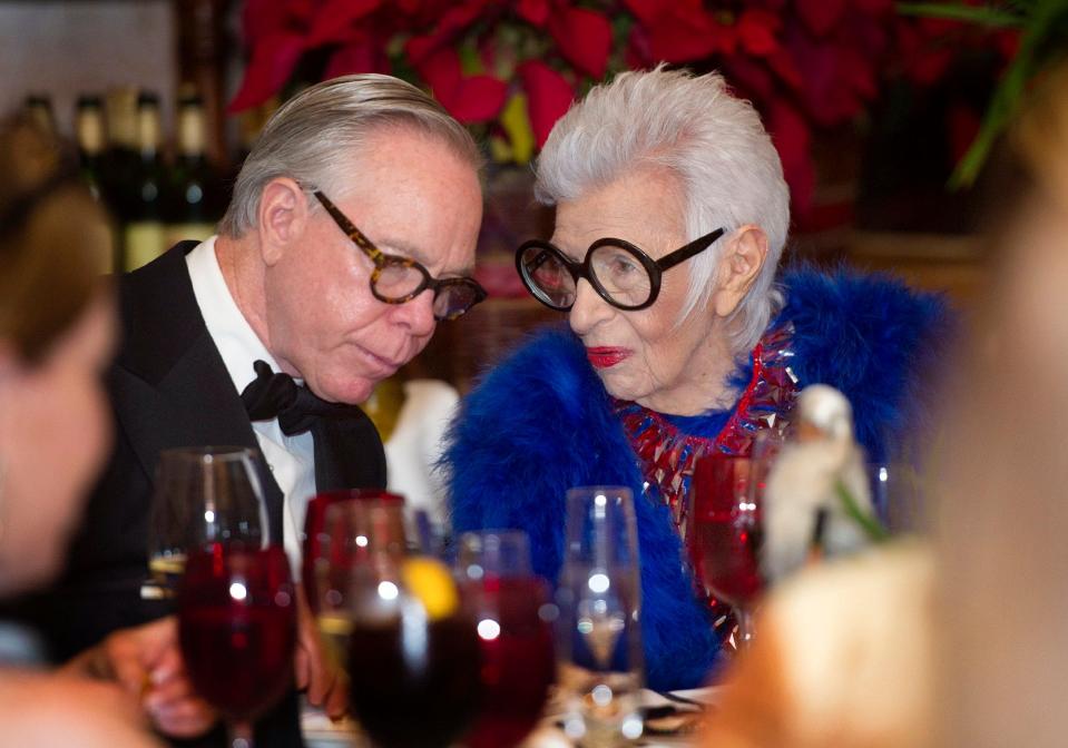 Tommy Hilfiger and Iris Apfel chat during the Ann Norton Sculpture Gardens: An evening with Iris Apfel at Cafe L'Europe Friday December 14, 2018 in Palm Beach.