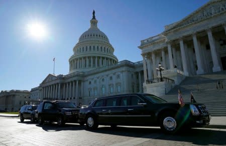 FILE PHOTO: The Presidential motorcade awaits the departure of U.S. President Donald Trump from the U.S. Capitol in Washington, DC, U.S. on November 28, 2017.  REUTERS/Kevin Lamarque/File Photo