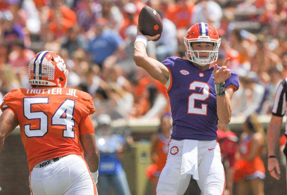 Clemson quarterback Cade Klubnik (2) passes near Clemson linebacker Jeremiah Trotter Jr. (54) during the first quarter the annual Orange and White Spring game at Memorial Stadium in Clemson, S.C. Saturday, April 15, 2023. 