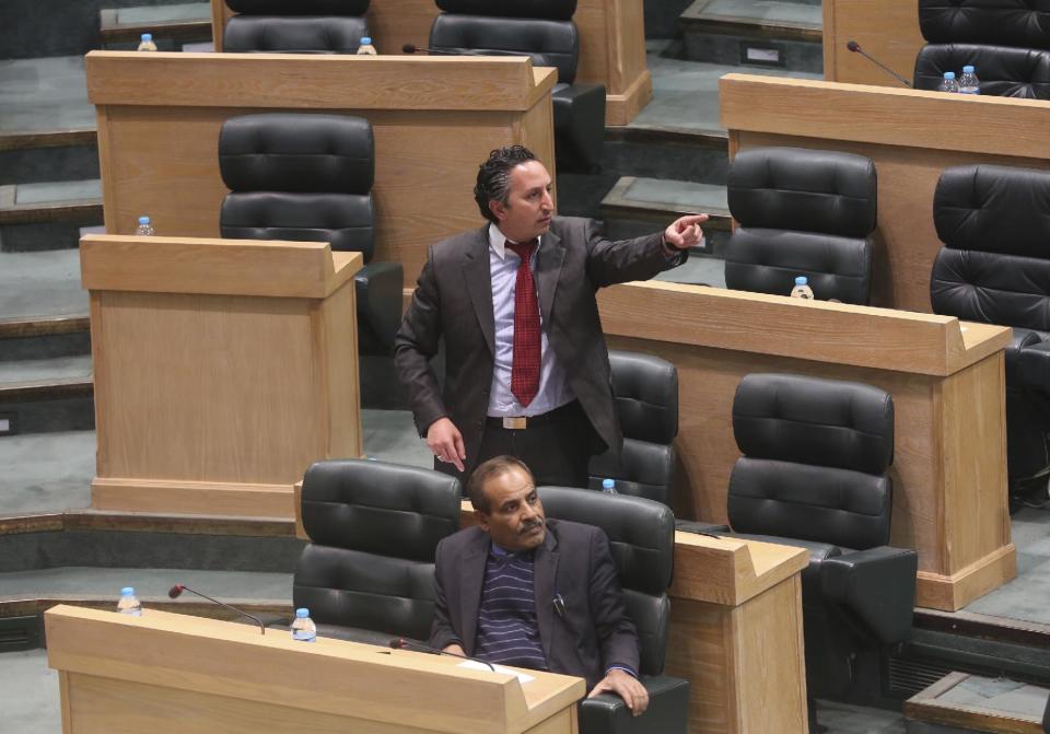 Jordanian lawmakers speak during the second day of a heated debate on the U.S. push for a peace deal between Israelis and Palestinians, under the domed parliament chamber in the capital, Amman, Jordan, Tuesday, Feb. 4, 2014. The kingdom is already home to the largest Palestinian population outside the West Bank and Gaza Strip, and Jordanian lawmakers and others fear the Palestinians will be coerced into an accord that gives up land and leads to a new influx of refugees into Jordan. (AP Photo)