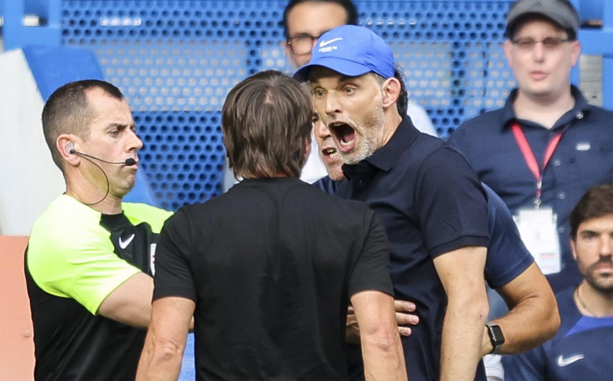 Head Coachs' Antonio Conte of Tottenham Hotspur and Thomas Tuchel of Chelsea square up to each other after Pierre-Emile Hojbjerg of Tottenham Hotspur scores a goal to make it 1-1 during the Premier League match between Chelsea FC and Tottenham Hotspur - Robin Jones/Getty Images