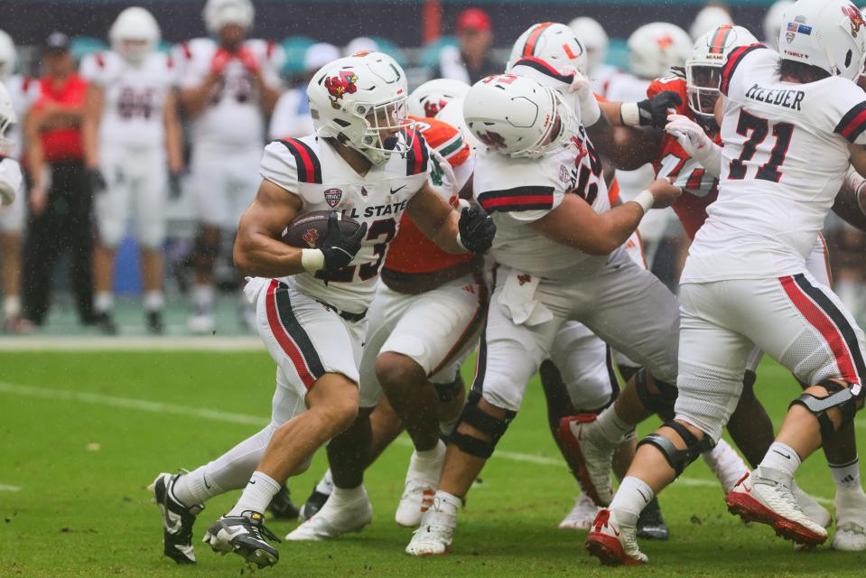 September 14, 2024; Miami Gardens, Florida, USA; Ball State Cardinals running back Vaughn Pemberton (23) runs with the football against the Miami Hurricanes in the first quarter at Hard Rock Stadium. Mandatory Photo Credit: Sam Navarro-Imagn Images