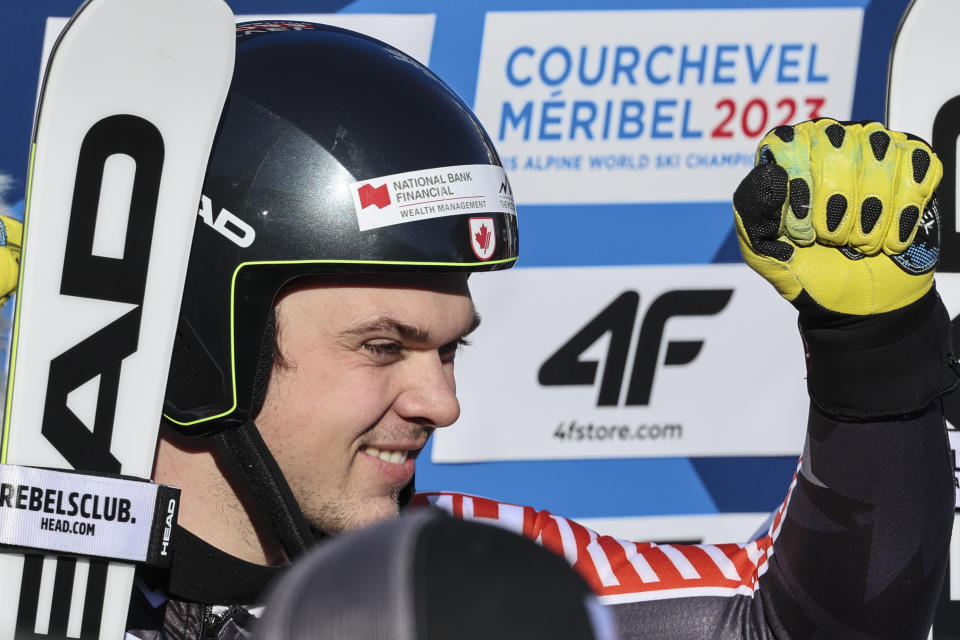 Canada's James Crawford celebrates in the finish area after completing an alpine ski, men's World Championship super-G race, in Courchevel, France, Thursday, Feb. 9, 2023. (AP Photo/Marco Trovati)