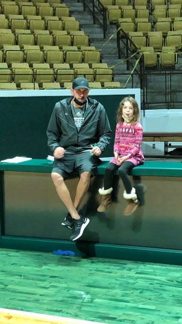Mark Lieberman and his daughter, Emery, during Lieberman's stint as a men's basketball coach at Southeastern Louisiana University in Hammond, La. A former Louisville assistant, Liberman is coaching a team of mostly former Cardinals in The Basketball Tournament.