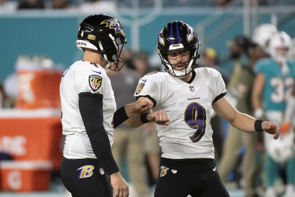 Baltimore Ravens punter Sam Koch and kicker Justin Tucker celebrate Tucker kicking a field goal.