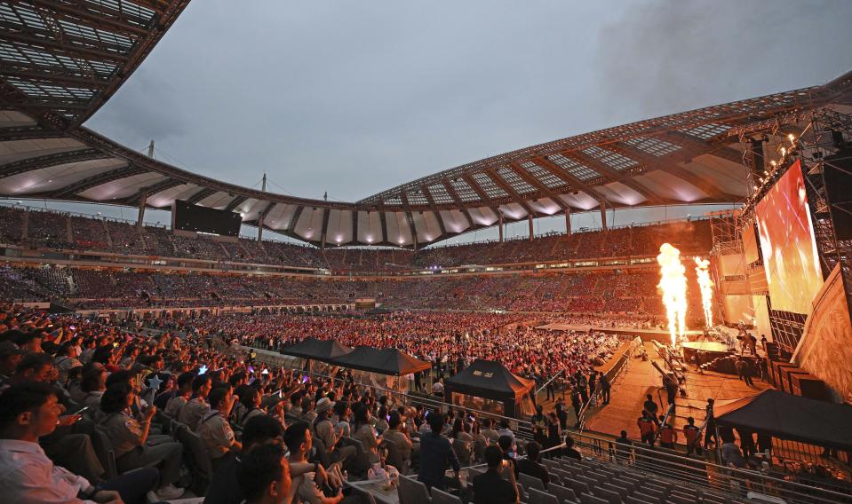 Attendees of the World Scout Jamboree watch a K-Pop concert after the closing ceremony of the World Scout Jamboree at the World Cup Stadium in Seoul, South Korea, Friday, Aug. 11, 2023. Flights and trains resumed and power was mostly restored Friday after a tropical storm blew through South Korea, which was preparing a pop concert for 40,000 Scouts whose global Jamboree was disrupted by the weather. (Korea Pool via AP)