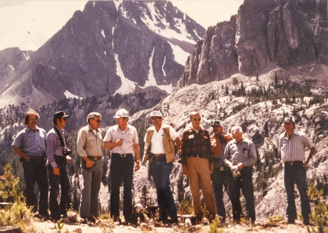 July, 1981, Forest Service officials meet with an ASARCO official on a trip into the ASARCO mining claims in the White Clouds. The group was assessing the impact of an informally proposed road which would have made more thorough exploration for molybdenum possible. No formal proposal was made. L-R: Mark Anderson, SNRA engineer; Dave Hoefer, SNRA planner; Al Ashton, SNRA superintendent; Paul Baker, Sawtooth Forest supervisor; John Balla, ASARACO new exploration manager; Jeff Jones, SNRA geologist; Dow Bond, Sawtooth Forest engineer; Bill Johnson, RO minerals manager; Tom Streit, SNRA landscape architect.